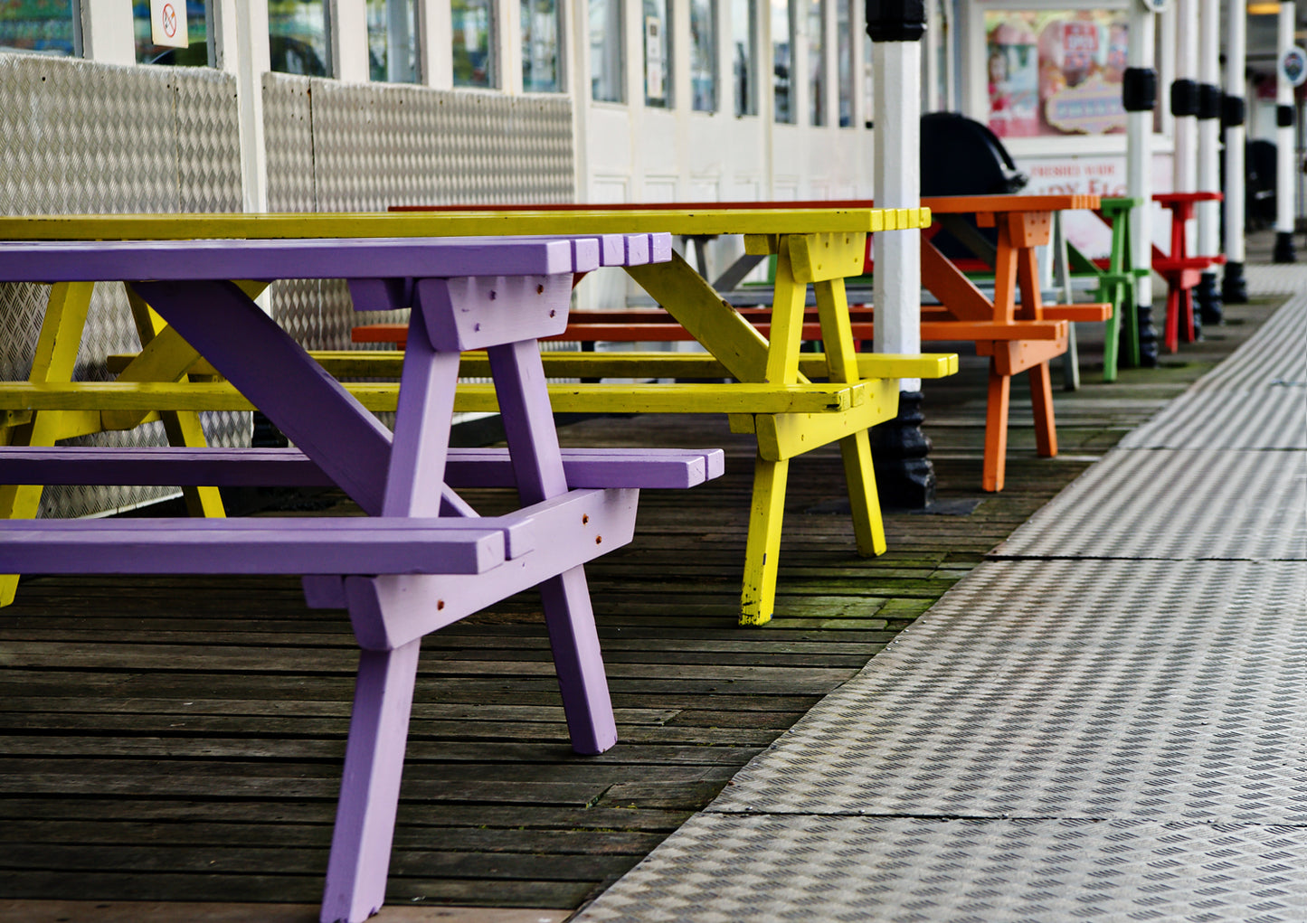 Coloured Benches on the Palac Pier Brighton Limited Edition Print By Stef Kerswell