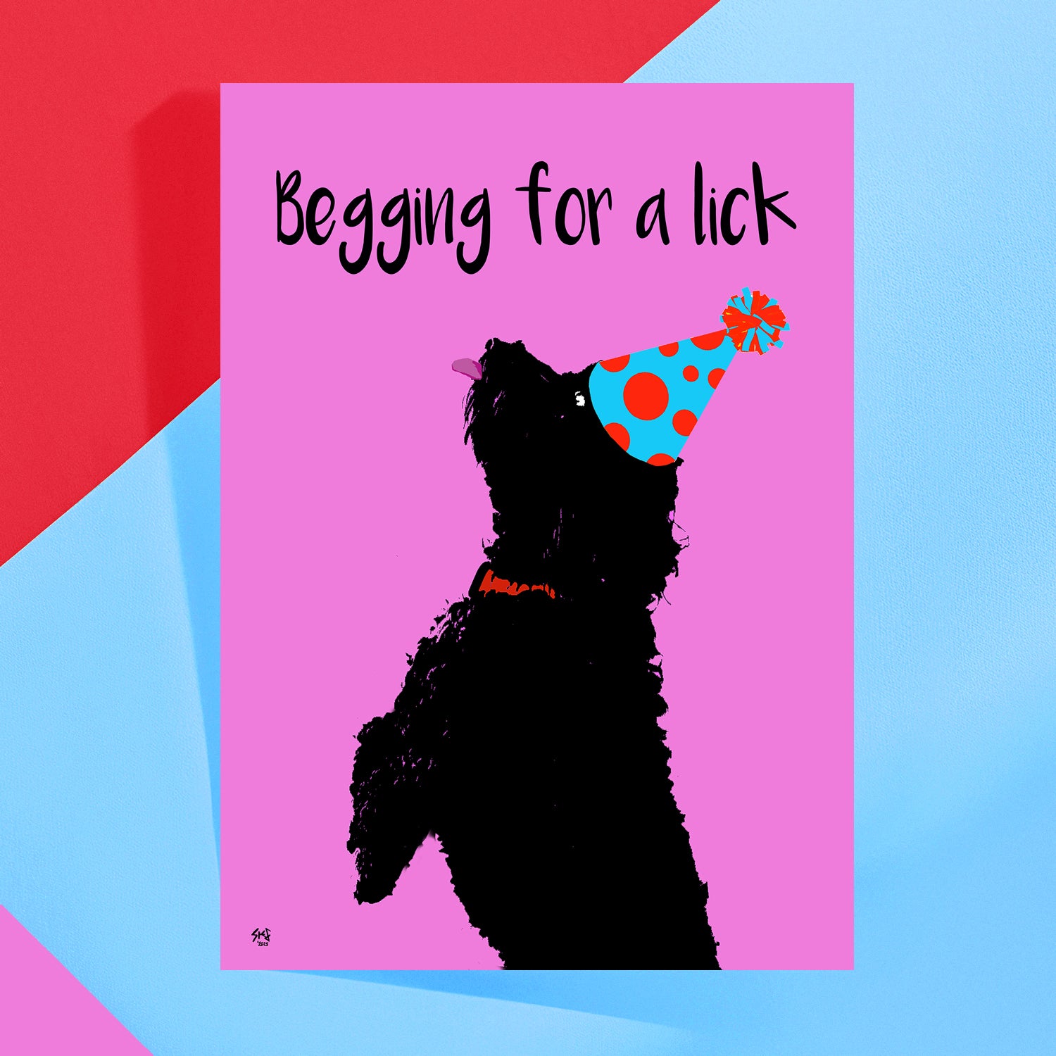 Rude card with a black dog silhouette, party hat, and text 'Begging for a lick' on a pink background by Studio Flea
